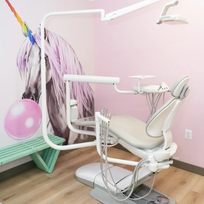 exam room with a unicorn drawing on a wall