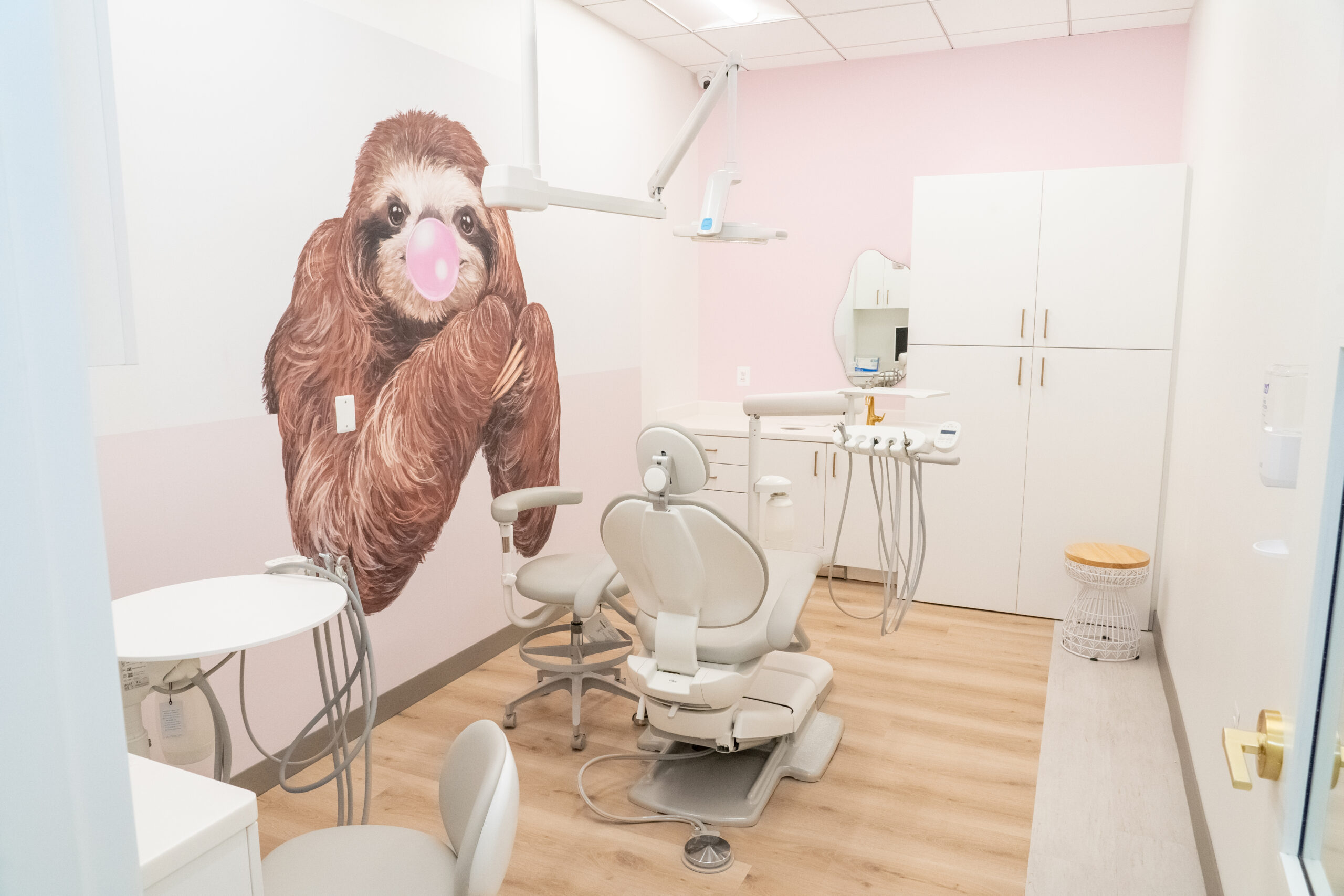 20231013-DSC07974 Petite Smiles dental office with sloth wallpaper